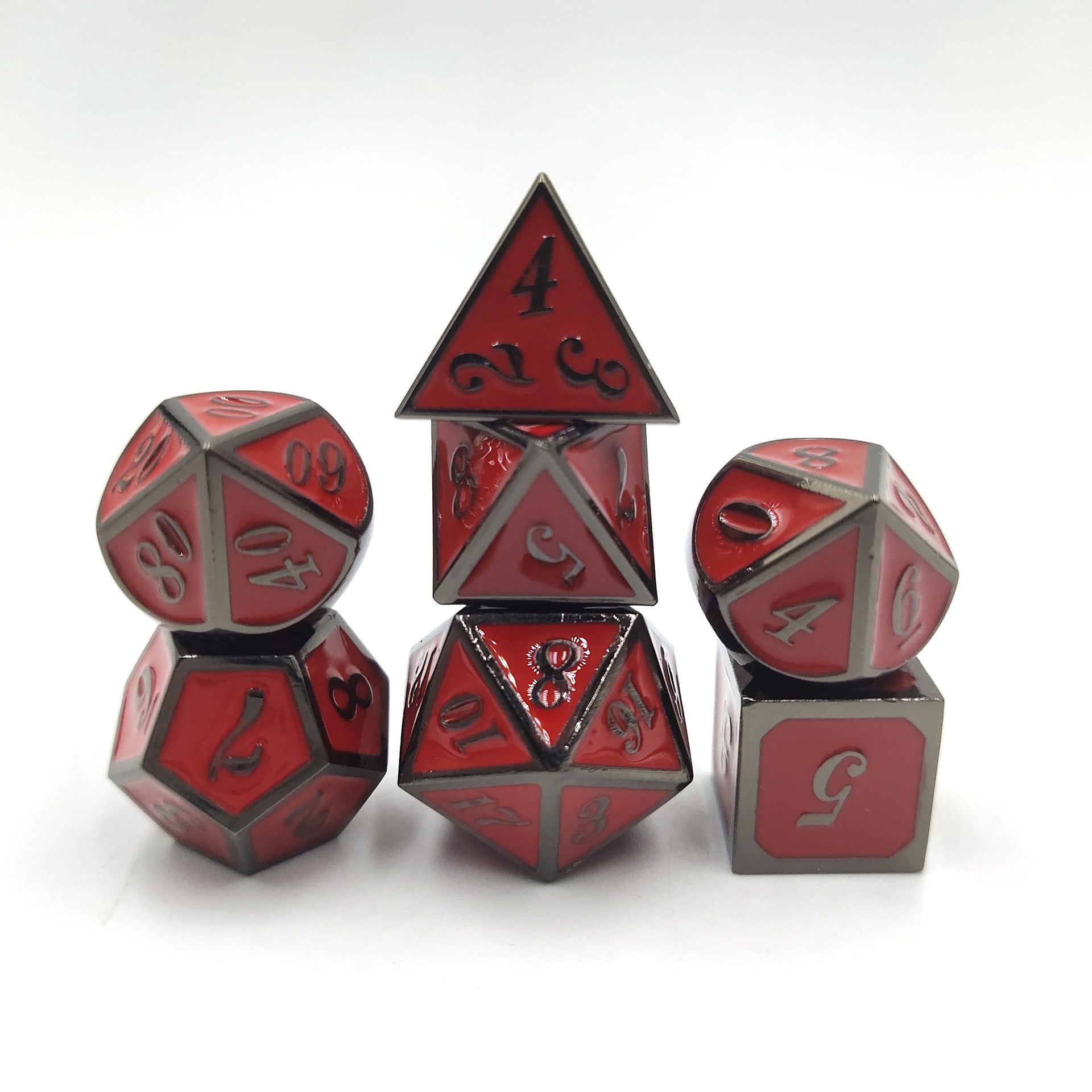 Set of red and gray polyhedral dice on a white background