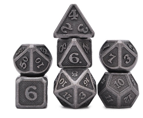 Set of metallic polyhedral dice on a white background