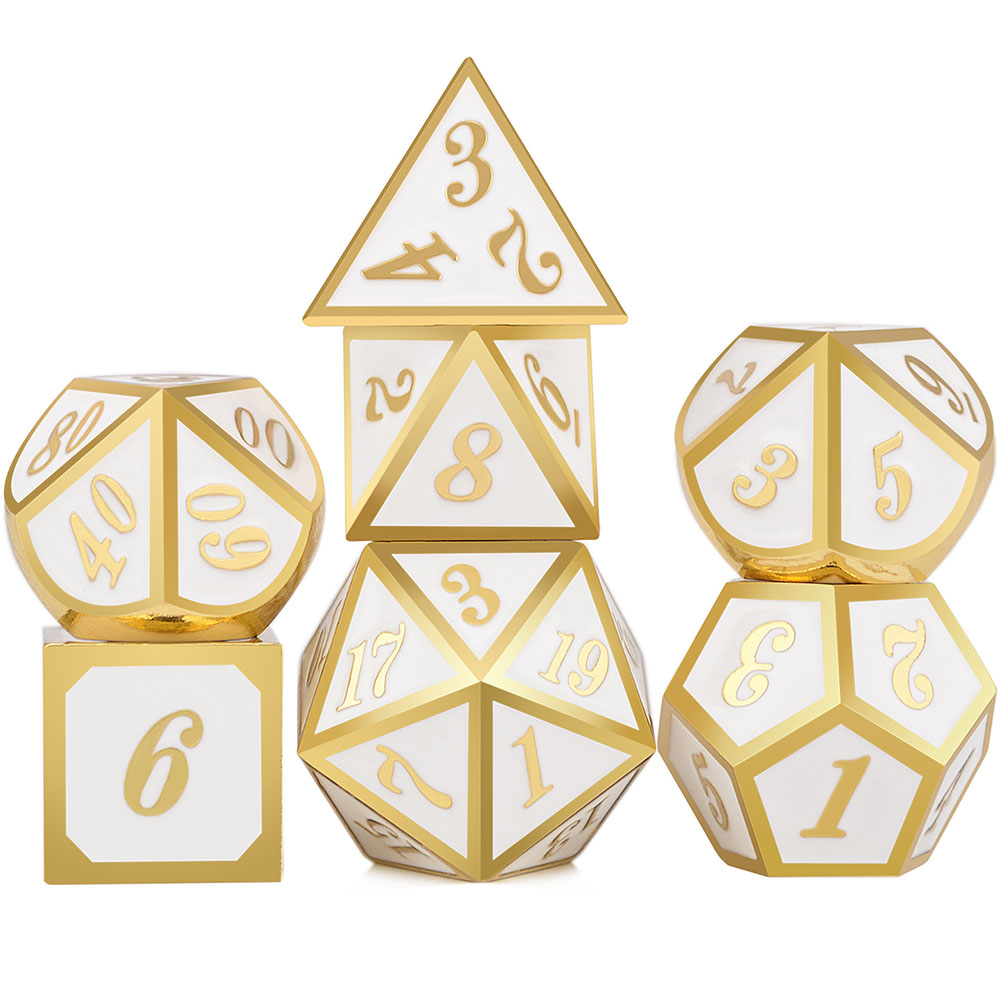 Set of gold and white polyhedral dice on a white background
