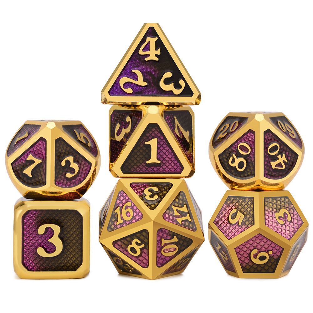 Set of metallic dice with gold and purple design on a white background