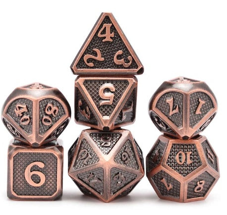 Set of copper-colored polyhedral dice on a white background