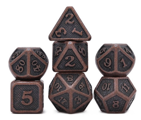 Set of metallic polyhedral dice on a white background